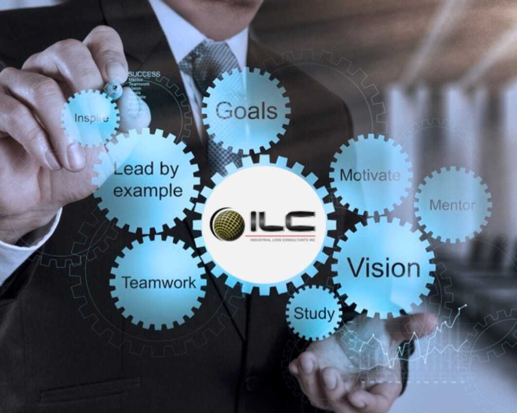 A business professional in a suit interacts with floating digital gears labeled with words such as “Inspire,” “Lead by example,” “Teamwork,” “Goals,” “Motivate,” “Mentor,” “Study,” and “Vision.”