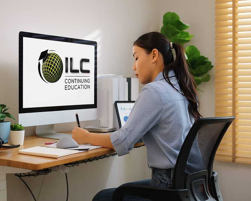 A young Asian woman sits at a wooden desk in a bright home office, writing in a notebook while looking at a large computer monitor. The monitor displays the centered ILC Continuing Education logo on a plain white background.